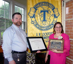 Margo Sue Bittner being presented with the Distinguished Toastmaster award