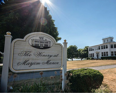 Marjim Manor sign with sun rays